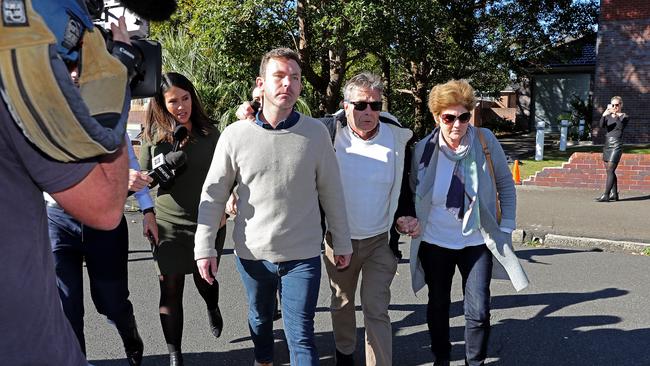 Warby’s parents leave Hornsby Police Station with him after he was arrested. Picture: Toby Zerna