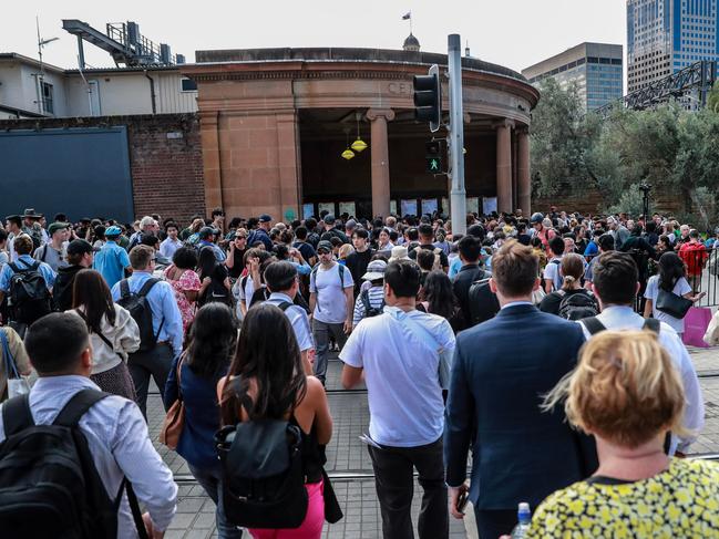 Commuters wait outside Central Station after Sydney trains ground to a halt shortly before the afternoon peak. Picture: Roni Bintang/Getty Images