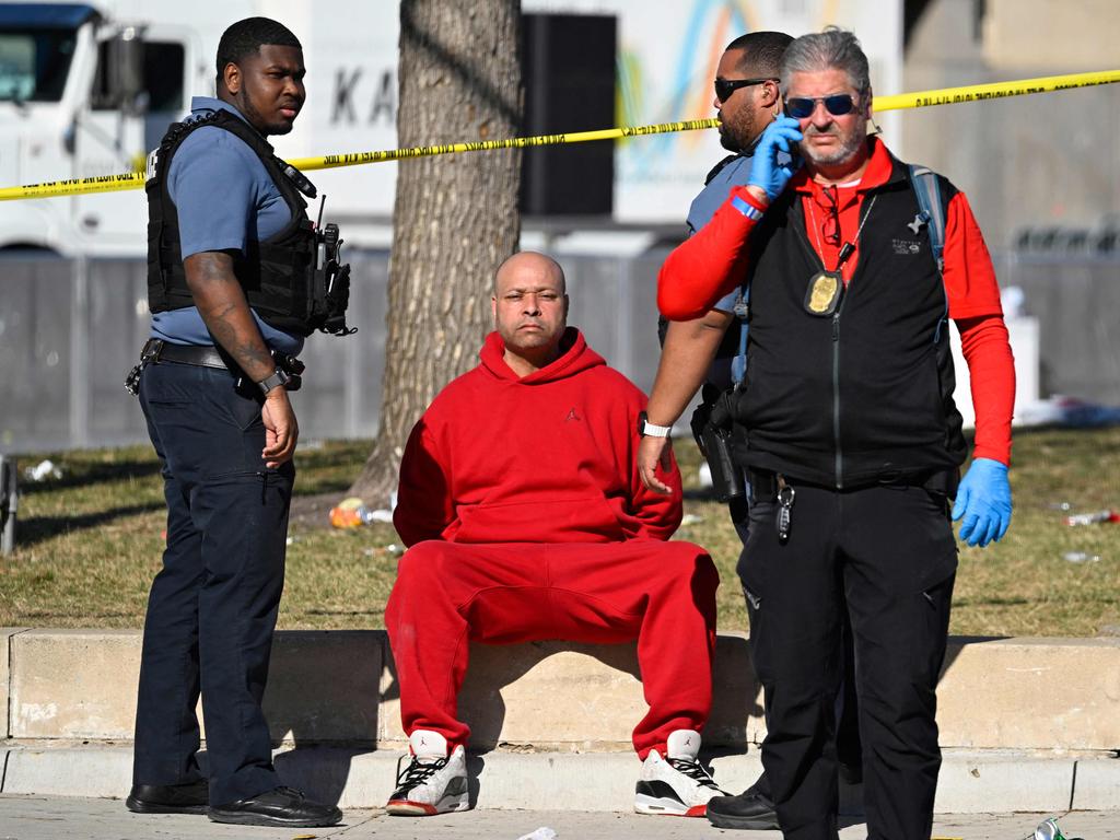 A person is detained by police near the Kansas City Chiefs' Super Bowl LVIII victory parade in Kansas City, Missouri. Picture: AFP