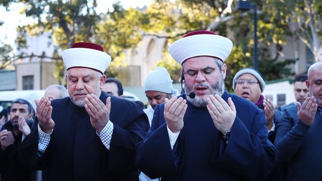 Sheik Yahya Safi, right, leads the prayers at Lakemba Mosque in Western Sydney. Picture: Hollie Adams