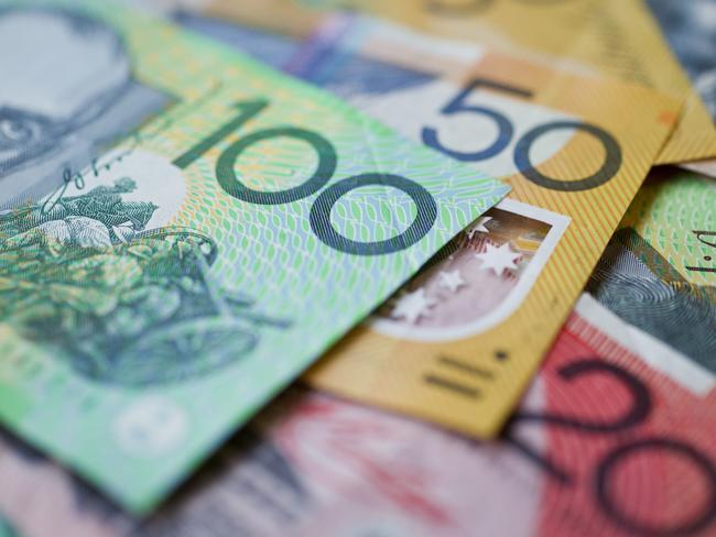 Australian money background showing $100, $50 and $20 notes with a shallow depth of field.