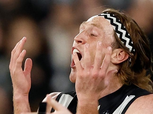 MELBOURNE, AUSTRALIA - JULY 28: Darcy Moore of the Magpies and Nathan Murphy of the Magpies react to AFL Field Umpire, Brendan Hosking's decision during the 2023 AFL Round 20 match between the Collingwood Magpies and the Carlton Blues at The Melbourne Cricket Ground on July 28, 2023 in Melbourne, Australia. (Photo by Michael Willson/AFL Photos via Getty Images)