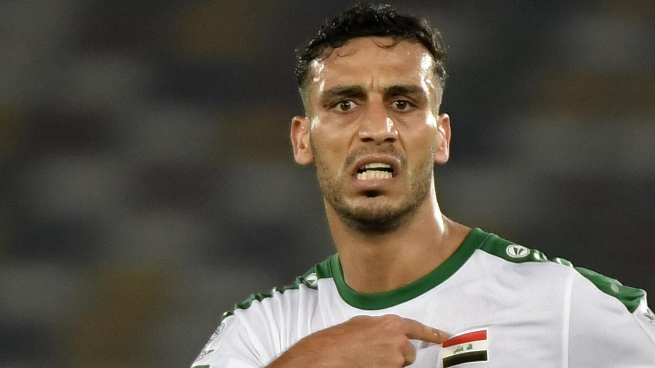 Iraq's defender Ali Adnan celebrates. (Photo by Khaled DESOUKI / AFP)