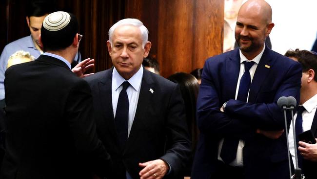 Israeli Prime Minister Benjamin Netanyahu (C) stands at the Knesset. Picture: AFP.