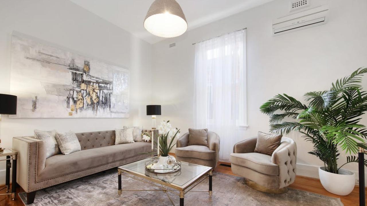 High ceilings and wooden floorboards feature in the house.