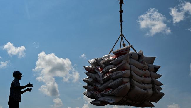 Rice imported from Thailand is unloaded at Malahayati in Indonesia's Aceh province earlier this month. Picture: AFP