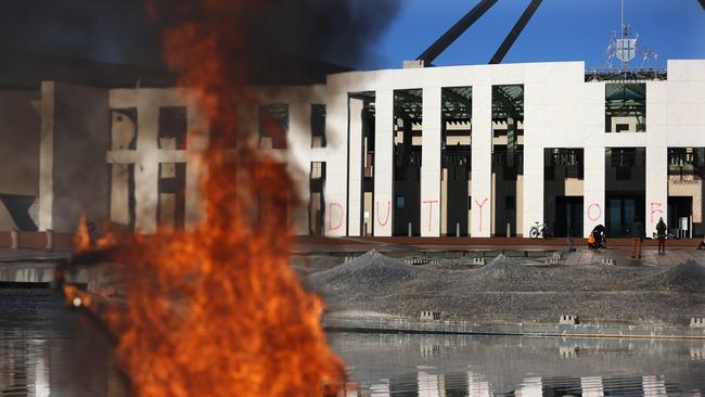 A fire burns on the Parliament House forecourt. Picture: NCA NewsWire / Gary Ramage