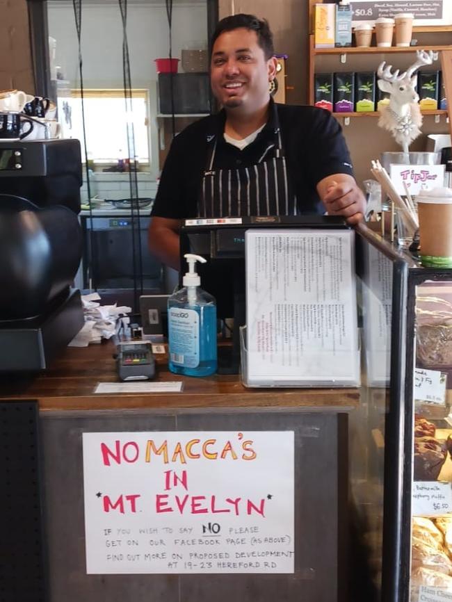 A sign has been erected at the Passchendaele Cafe in Mt Evelyn opposing the McDonalds.