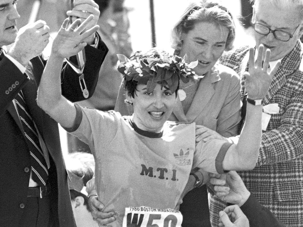 Rosie Ruiz waves to the crowd after being announced as winner. (AP Photo/File)