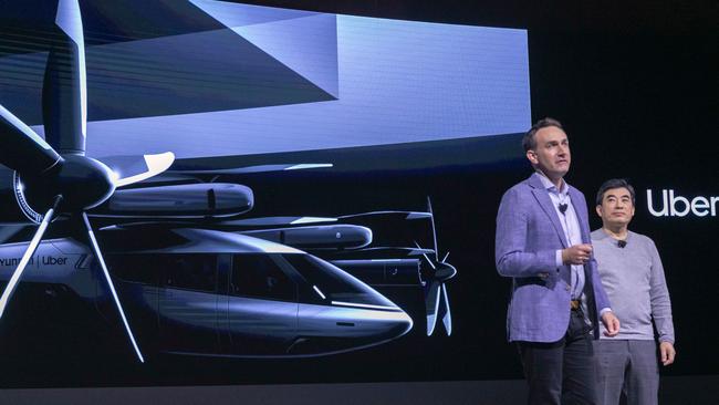 Eric Allison (left), Head of Uber Elevate, and Jaiwon Shin, Head of Urban Air Mobility at Hyundai, talk about the S-A1 electric vertical takeoff and landing (eVTOL) aircraft at the Hundai news event where Hyundai announced it's partnership with Uber to create an air taxi network. Picture: AFP)