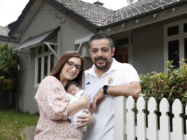 Daniel and Anita Lourenco with their newborn daughter Valentina, outside a house they are looking at buying in Artarmon. Picture: Jonathan Ng