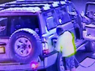 One of the four kids filling up the Nissan Patrol at the service station in Banana, before driving off without paying. Picture: Bill North