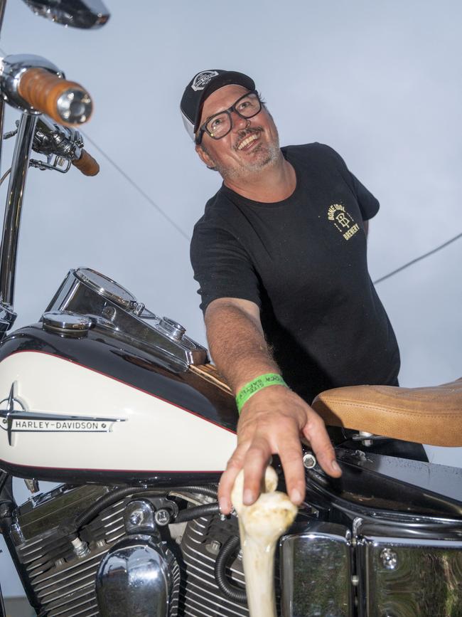 Alister Ferguson with his 1998 Harley Davidson Dyna Wide Glide complete with animal bone gearshifter at Meatstock, Toowoomba Showgrounds. Saturday, April 9, 2022. Picture: Nev Madsen.