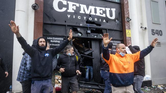 CFMEU members protect the building after chaos erupts. Picture: David Geraghty