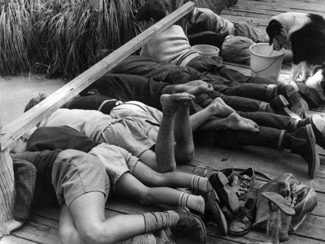 Kids fish for yabbies at a footbridge in January, 1965.