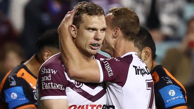 SYDNEY, AUSTRALIA - AUGUST 22: Tom Trbojevic of the Sea Eagles celebrates scoring a try with DalyÃÂ Cherry-Evans of the Sea Eagles during the round 25 NRL match between Wests Tigers and Manly Sea Eagles at Leichhardt Oval on August 22, 2024 in Sydney, Australia. (Photo by Jason McCawley/Getty Images)