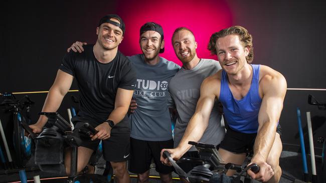 Sam Young, Sam Patterson, Alex Triplow and Aussie Edwards taking part in a spin class at Studio 360 Bike Club. Picture: Mark Brake