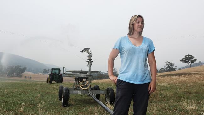 Judbury farmer Angela Bond using an irrigator to water paddocks surrounding her family's property. Picture: LUKE BOWDEN