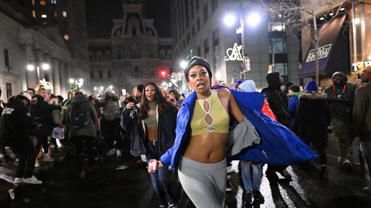 Rowdy Eagles fans flip parked car ahead of Super Bowl