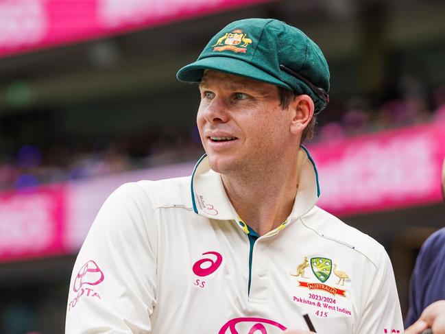 Steve Smith signs autographs for the crowd on the first day of the Sydney Test, David Warner's last test match. Photographer: Tom Parrish