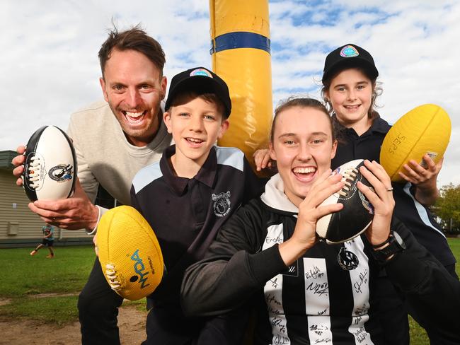 . Towards a better future. Resilience project .Collingwood WAFL player Jordan Allen  and Hugh Van Cuylenburg with Shepparton East primary school students Alex and Lexi .Picture:Rob Leeson