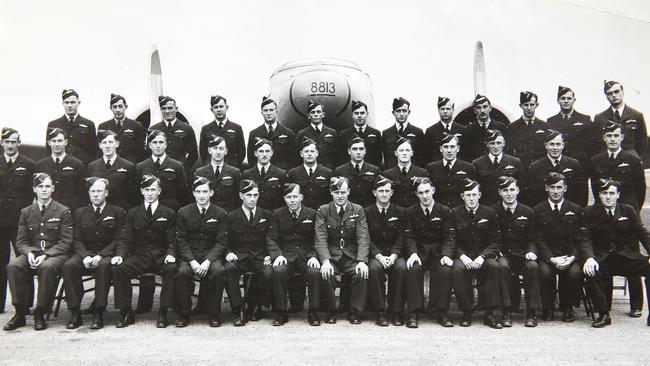 Laurie Larmer is pictured in the back row six from the right, with his squadron during WWII. Picture: David Caird