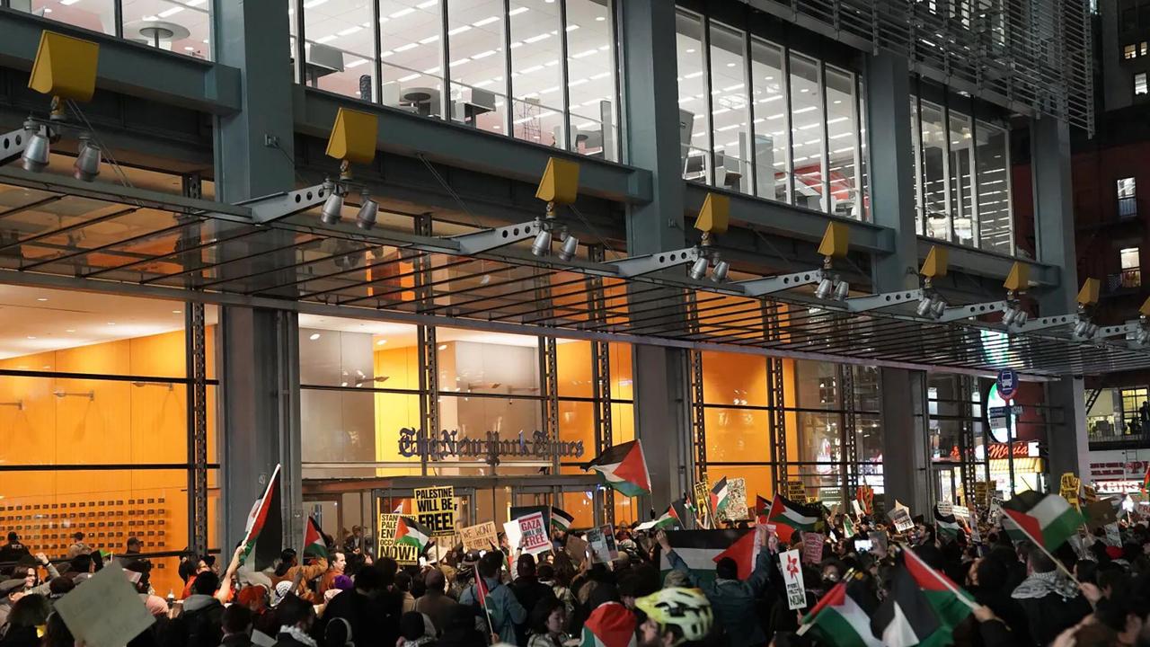 The protesters unfurled banners calling for a ceasefire and handed out mock newspaper copies. Picture: Barry Williams/New York Daily News/TNS/Alamy