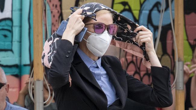 Con artist Samantha Azzopardi wrapped a scarf around her hair and wore a mask and sunglasses to disguise her looks. Picture: Simon Bullard