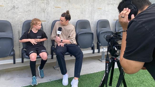 Matildas fan Harper, 9, interviews her idol Mackenzie Arnold for news.com.au.