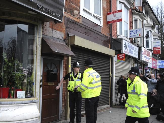 Hundreds of detectives worked through the night leading to raids on six properties and eight arrests. This flat above a restaurant in Birmingham was searched. Picture: AP Photo.