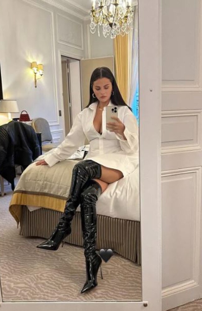 Rocking sexy boots on yet another night out in Paris.