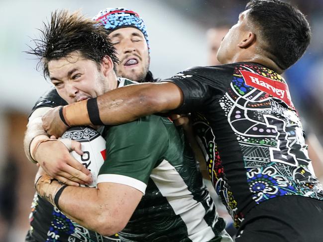 Brandon Smith of the Maori Kiwis is tackled by Josh Curran and Tyrone Peachey of the Indigenous All Stars (right) during the 2020 NRL Indigenous All-Stars vs Maori Kiwis match. (AAP Image/Dave Hunt)