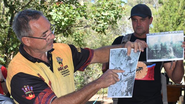 Wit-booka explaining the history of the site using old photographs. Photo: Kristen Camp