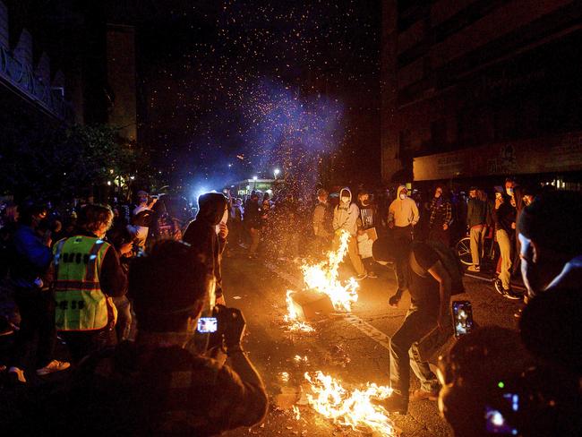 Demonstrators burn garbage in Oakland, California. Picture: AP