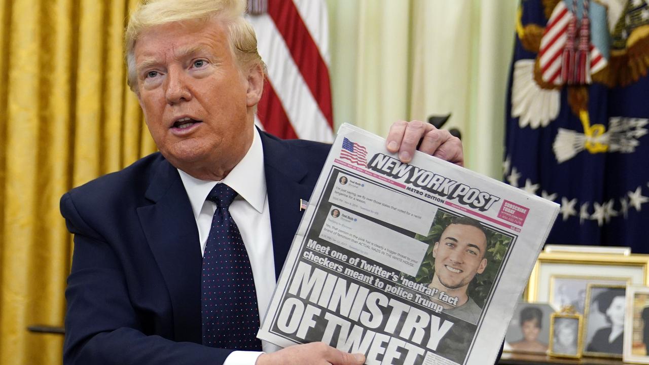 President Donald Trump holds up a copy of the New York Post as he speaks before signing an executive order aimed at curbing protections for social media giants last month. Picture: Evan Vucci/AP