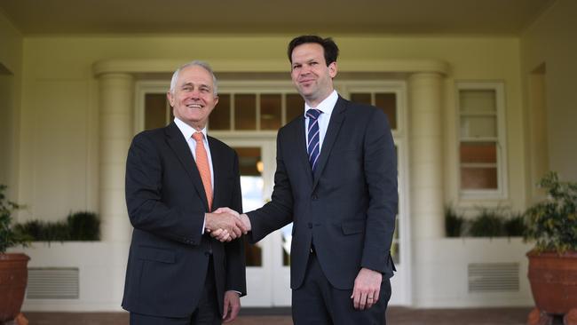 Malcolm Turnbull congratulates Matt Canavan after he was sworn in as a minister at Government House yesterday. Picture: AAP