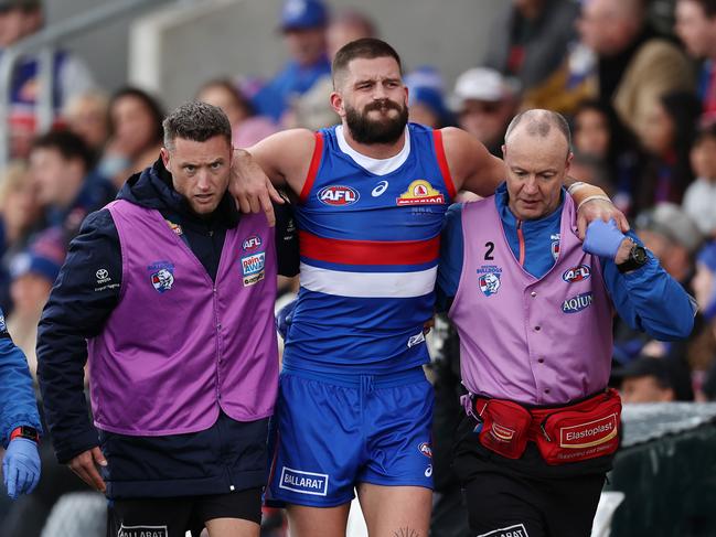 MELBOURNE, AUSTRALIA – July 29, 2023. AFL . Bulldog Josh Bruce is helped to the rooms after appearing to in sure his knee in the 3rd qtr during the round 20 match between Western Bulldogs and GWS Giants at the Mars Stadium on July 29, 2023, in Ballarat, Australia. Photo by Michael Klein.