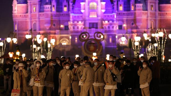 This photo taken on October 31, 2021 shows people preparing to undergo Covid tests at Shanghai Disneyland, as the park closed over a single coronavirus case. Picture: AFP