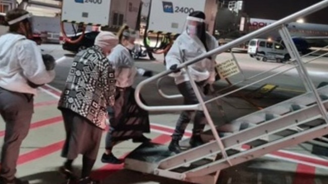 Malka Leifer (2nd L) is pictured boarding a plane at Ben Gurion Airport in Israel. Leifer is being extradited to Australia to face prosecution for historic sex crimes. Picture: Ynetnews