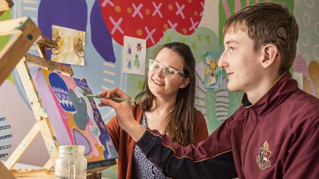 Local artist Alex Stalling shares her passion and expertise with George Storie. Deaf and hard of hearing teenagers will learn how to communicate artistically in a workshop designed to develop their creativity. Picture: Nev Madsen.