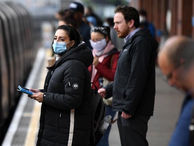 Commuters travel from West Ham towards central London after restrictions were eased. Picture: AFP