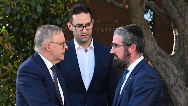 PM Anthony Albanese (left) and Labor member for MacNamara Josh Burns are greeted by Rabbi Yaakov Glasman (right) during a visit to the St Kilda Shule in Melbourne. Picture: AAP