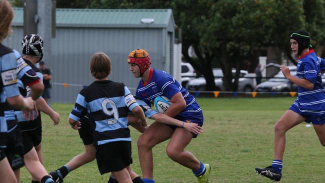 Day 1 of the King of the Country junior rugby union tournament at the Gold Coast Eagles Rugby Union Club.Maroochydore Swans (BLUE AND BLACK) vs USQ Saints (Blue ) Maroochydore Player No USQ Player No Pic Mike Batterham