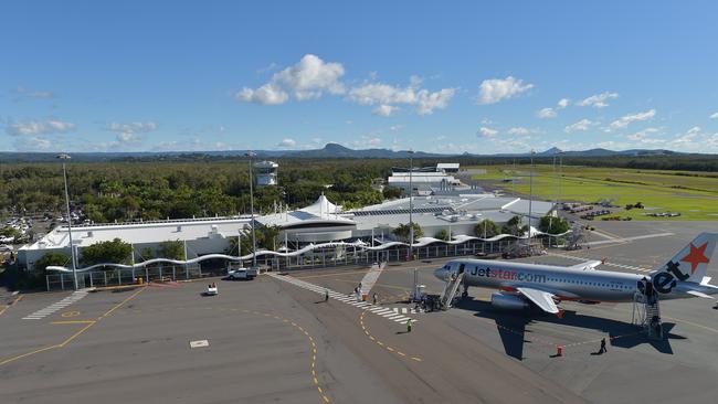 A Jetstar plane in front of the Sunshine Coast terminal, Sunshine Coast Airport.