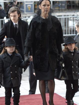 Family ... Singer Celine Dion arrives with sons Eddy and Nelson for the funeral for her husband Rene Angelil at Notre-Dame Basilica.  Picture:  AP