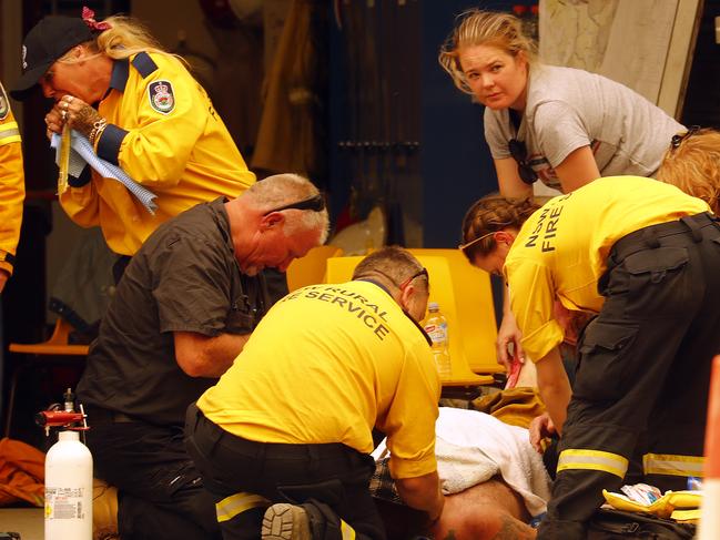 Mick Duggan (left) helped revive fallen firey Matt Eyles at Balmoral. Picture: Sam Ruttyn