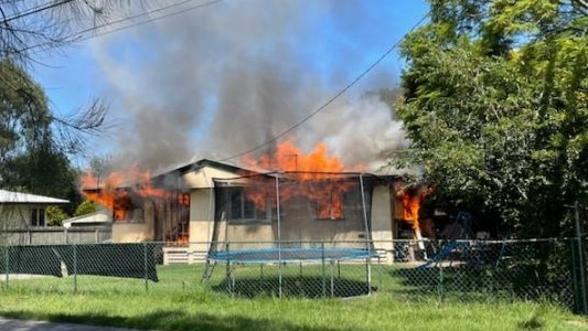 Firefighters on the scene of a serious house fire at Redbank. Picture: Daniel Houghton