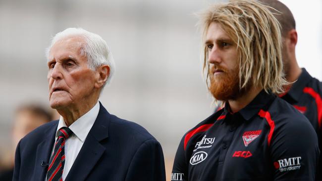 Jack Jones and Dyson Heppell during the last post at an Anzac Day ceremony.