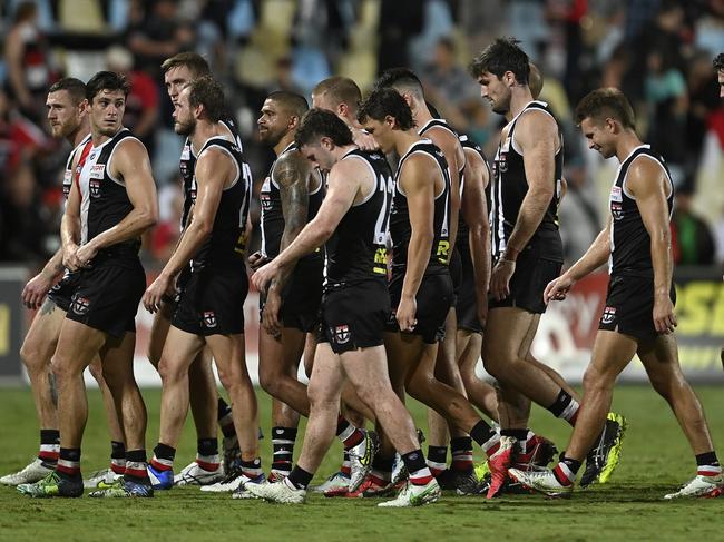 CAIRNS, AUSTRALIA - APRIL 30: St Kilda players walk from the field after losing the round seven AFL match between the St Kilda Saints and the Port Adelaide Power at Cazalys Stadium on April 30, 2022 in Cairns, Australia. (Photo by Ian Hitchcock/Getty Images)