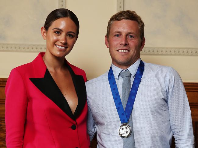 Surf nightmare.... Joel Trist pictured with Jesinta Franklin yesterday.